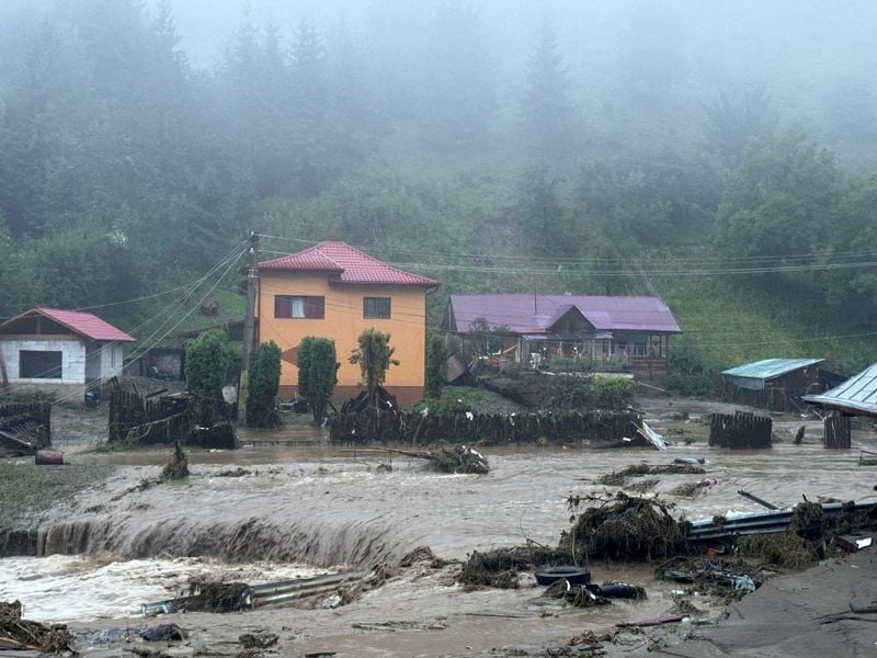 Image for Floods in Romania kill three, hundreds evacuated
