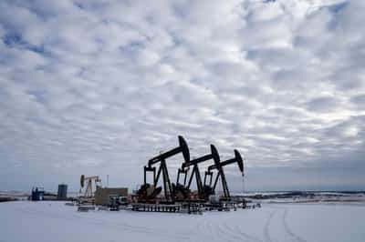 Image for Oil prices hover around four-month high, buoyed by Iran concerns, weak dollar
