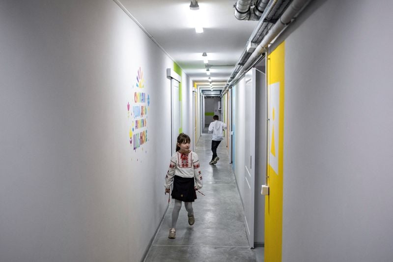 Image for Ukrainian children open school year by heading underground