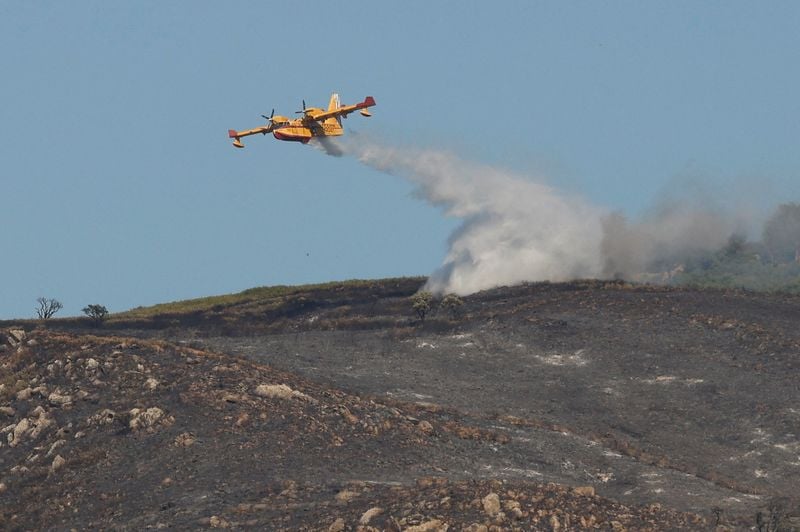 Image for Volunteer firefighter dies in Spain as wildfires rage