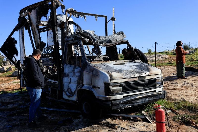 Image for Israeli settlers burn tents, vehicles in West Bank village, say residents