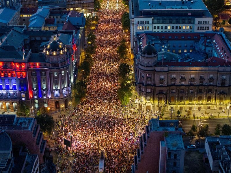 Image for Tens of thousands march in Serbia's capital, demand snap vote