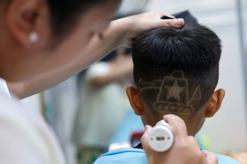 Image for China parade inspires military-themed haircuts for children