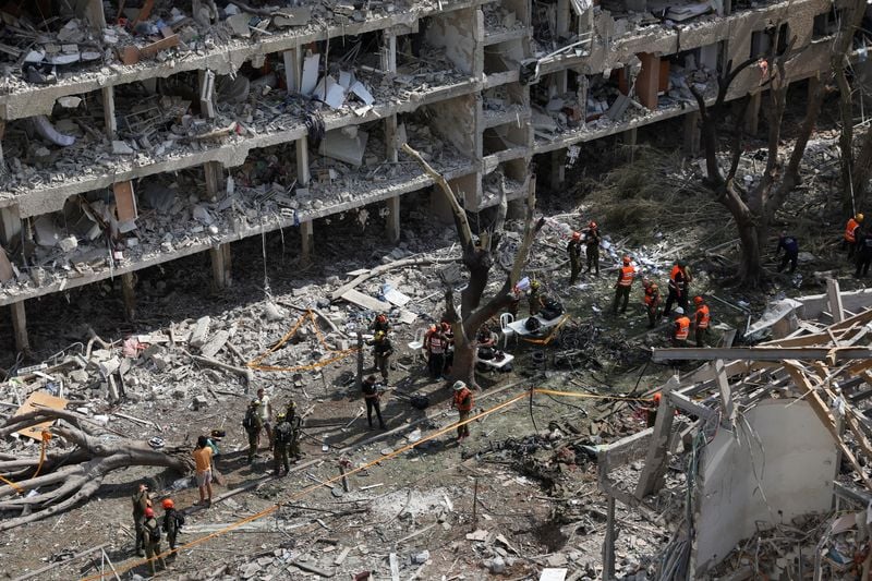 Image for Israelis who lost homes to Iranian missile confront rubble as shock sinks in