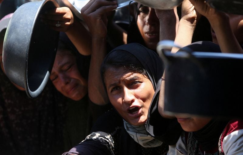 Image for More Gazans die seeking aid and from hunger; burial shrouds in short supply