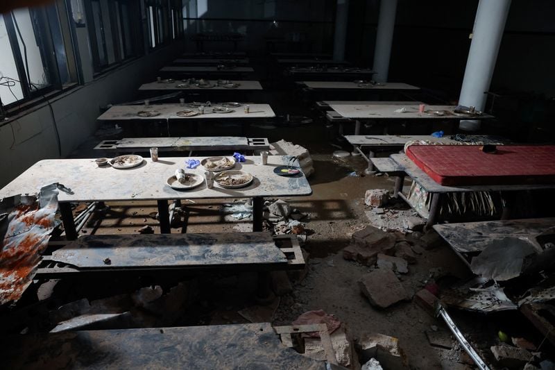Image for Lunch plates abandoned, plane parts embedded in walls after Air India jet hit doctors' hostel