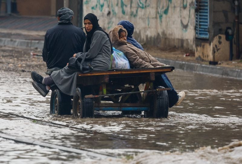 Image for Torrential rain flooded Gaza tents and a baby died of exposure, medics say
