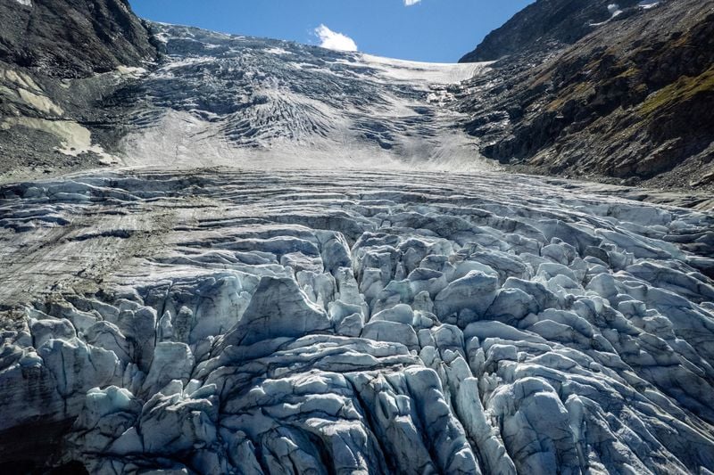 Image for Swiss glaciers melted sharply after light snowfall and heatwave, scientists say
