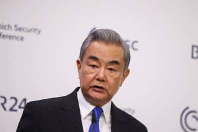 Image for China's top diplomat warns against 'knee-jerk' calls for decoupling
