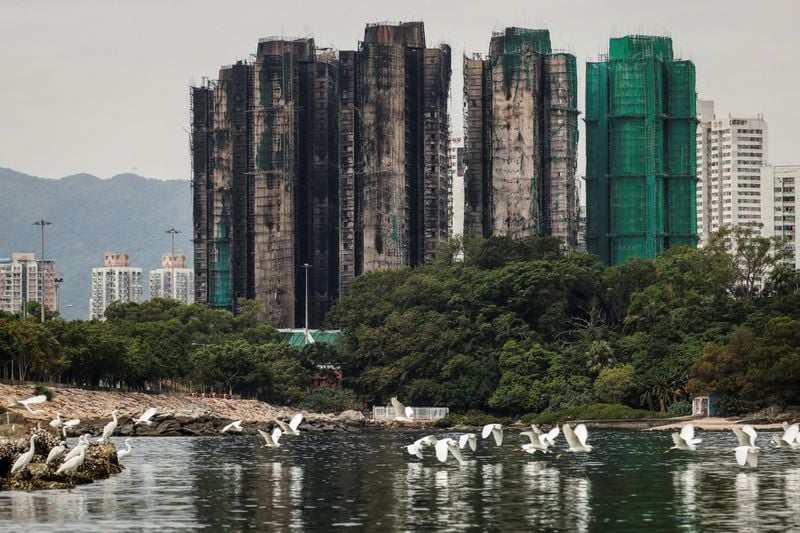 Image for Hong Kong plans to buy homes devastated in deadly high-rise fire