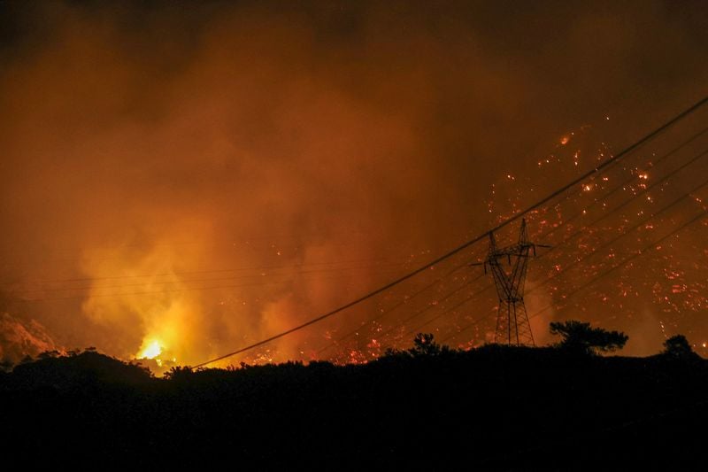 Image for New fire threatens homes in Greece's Athens, blaze in Crete displaces over 1,000, as Europe bakes in heatwave