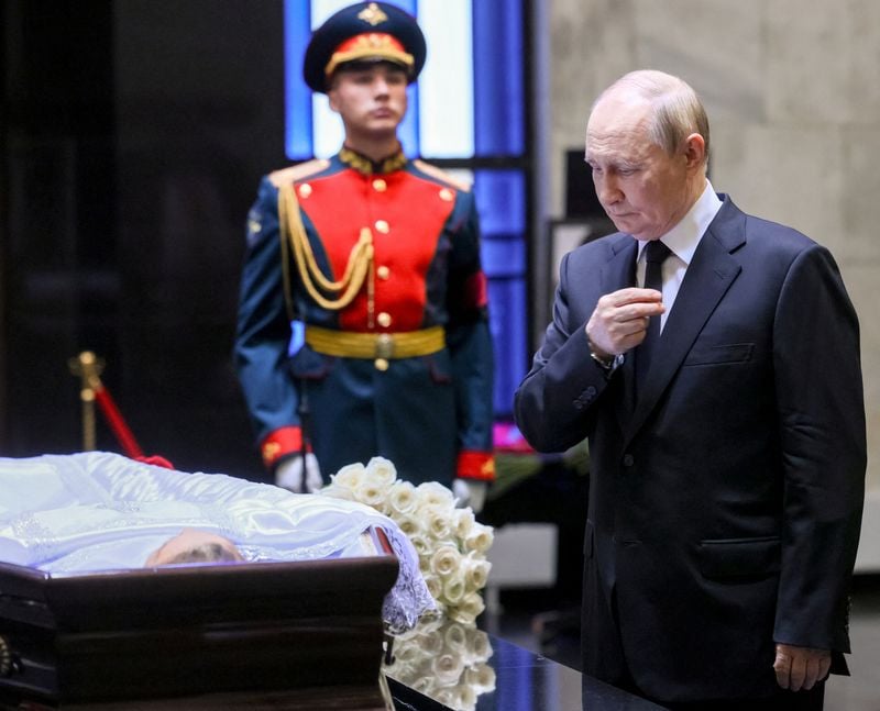 Image for Russia's Putin joins mourners to pay respects to ex-classmate and top judge
