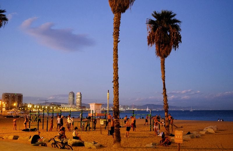 Image for Spaniards struggle to enjoy their own beaches in tourist deluge