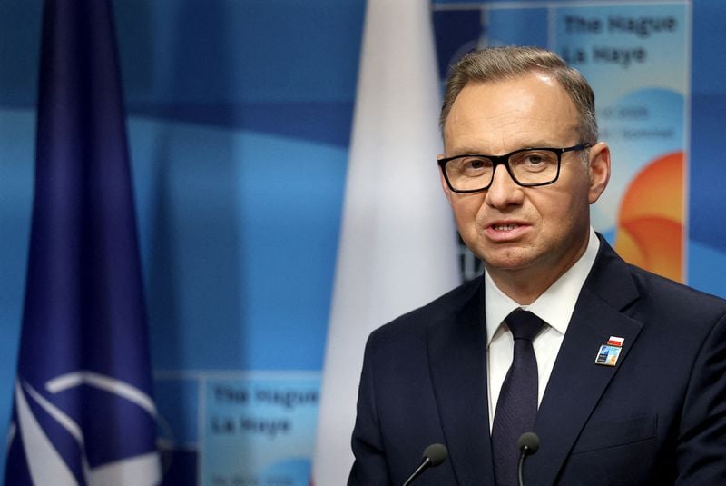 Image for Polish president says government trying to force him to sign wind farm laws