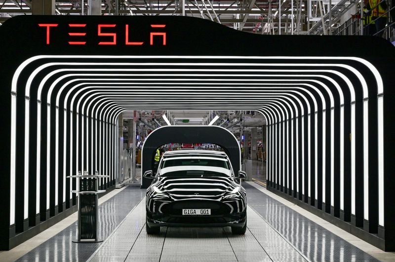 Image for Tesla likely faces 'a few rough quarters' from end of US EV support, Musk says