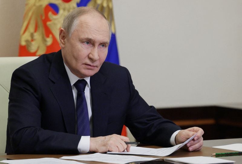 Image for Putin says Russia plans to cut military spending from next year