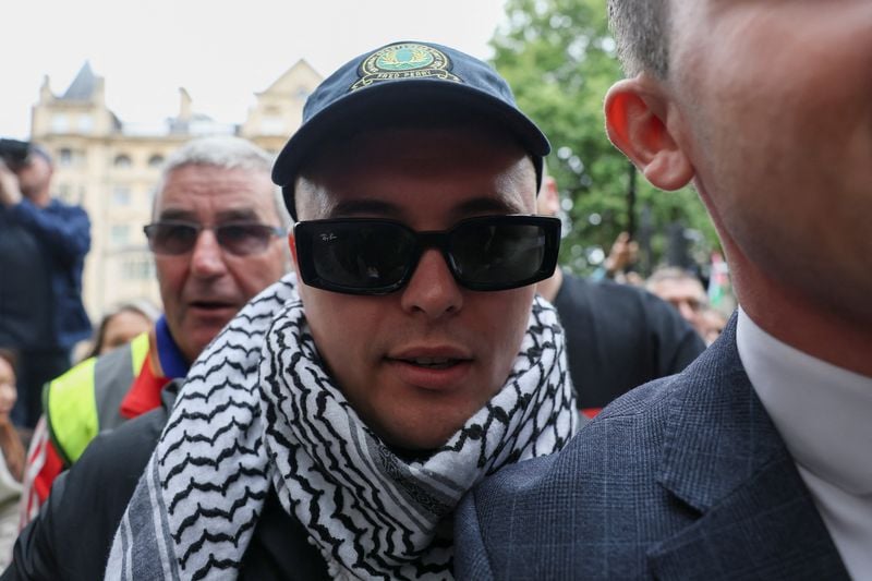 Image for Member of Irish rap group Kneecap appears at UK court on terrorism charge