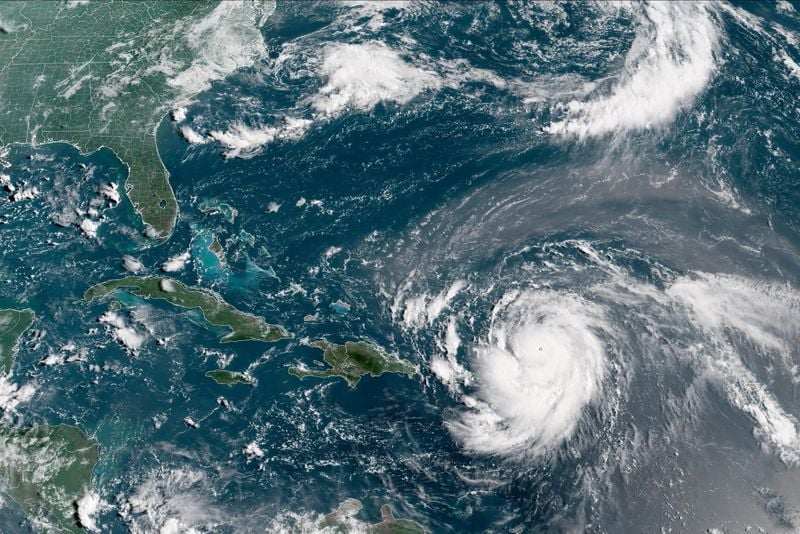 Image for Erin downgraded to Category 3 hurricane, NHC says
