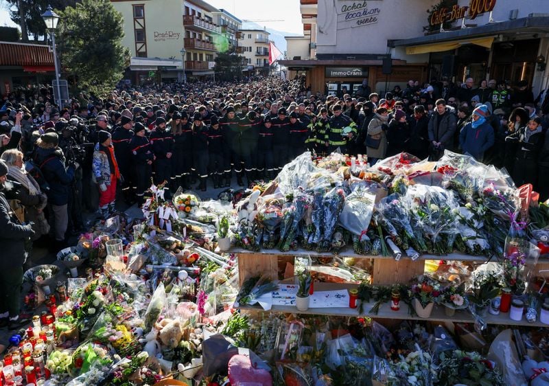 Image for Grieving Swiss town holds silent procession for victims of deadly bar fire