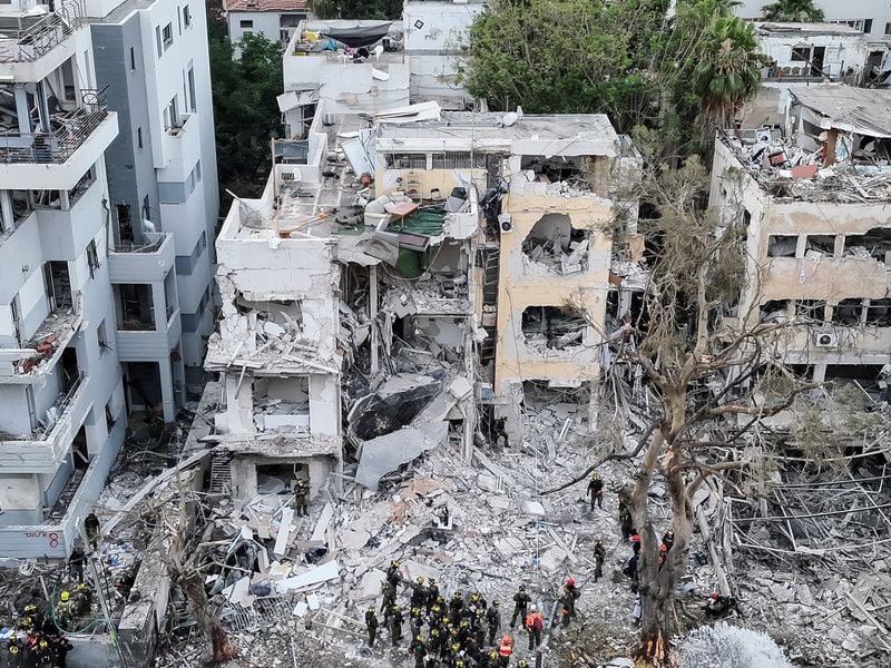 Image for War-weary Gazans share images of destruction in Israel