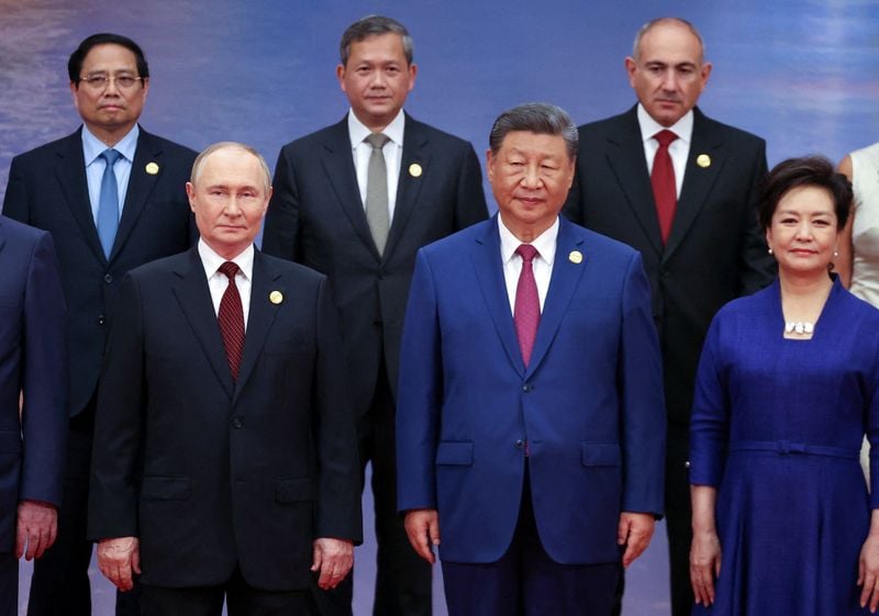 Image for China's Xi pushes a new global order, flanked by leaders of Russia and India