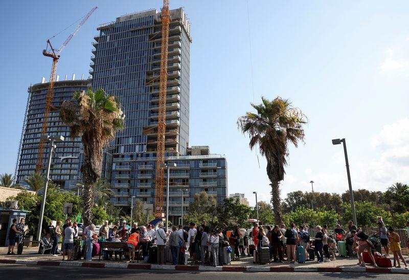 Image for Relieved foreigners leave a tense Israel after truce with Iran