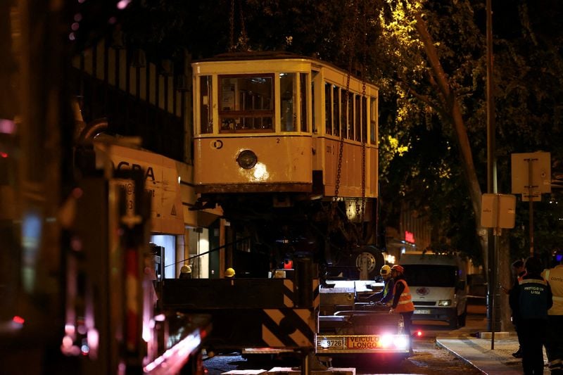 Image for Three Britons among dead in Lisbon funicular crash as wreckage removed
