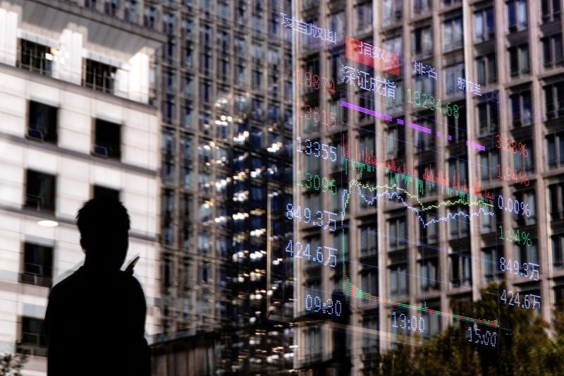 Image for Stocks falls on megacap drag, yen stumbles after BOJ announcement