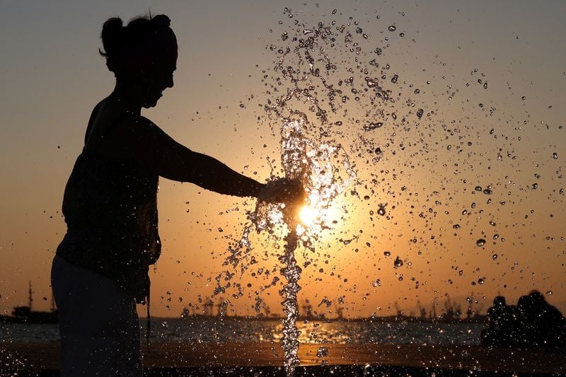 Image for Labourers barred from work, tourists kept from ruins as heatwave sears Greece, Balkans