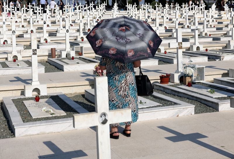 Image for Greeks mourn, Turks celebrate anniversary of invasion that split Cyprus