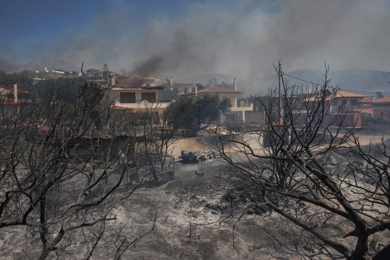 Image for Greece battles wildfires across country, evacuates villages
