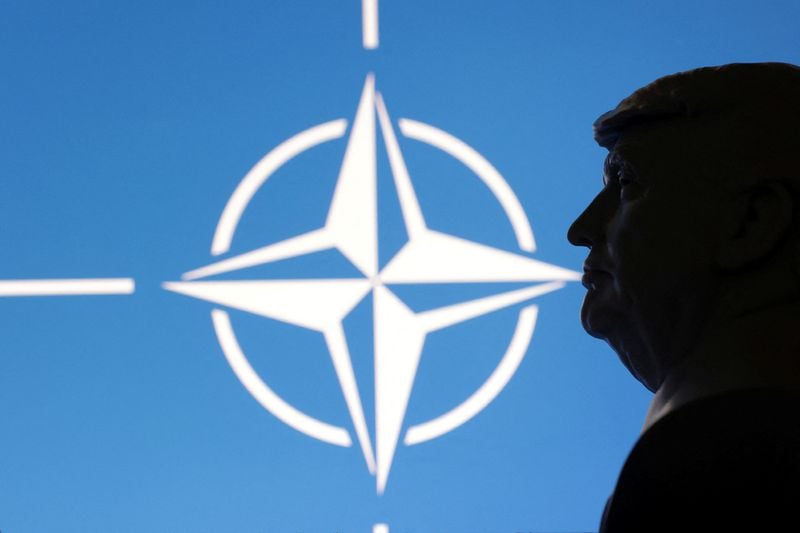 Image for US to cut roughly 200 NATO positions, sources say