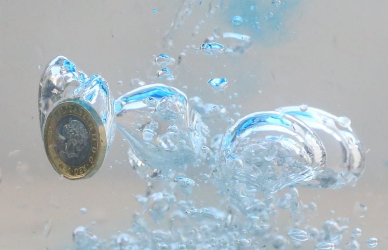 Image for Sterling treads water as data paints sombre picture before budget