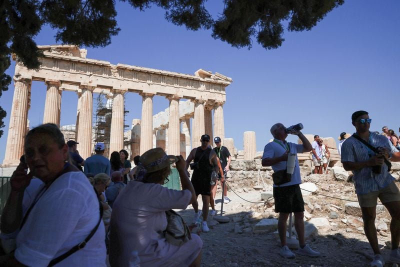 Image for Greece shuts Acropolis for part of day as heat soars, bans outdoor work
