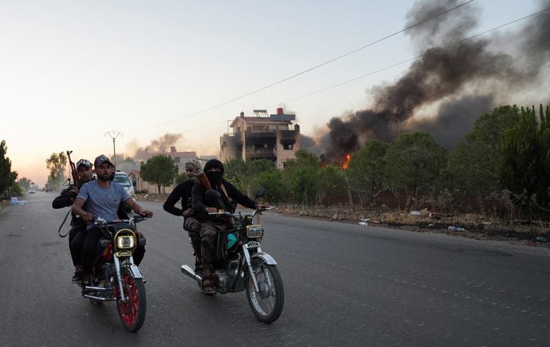 Image for Clashes rage in Druze region as Syria struggles to enforce ceasefire