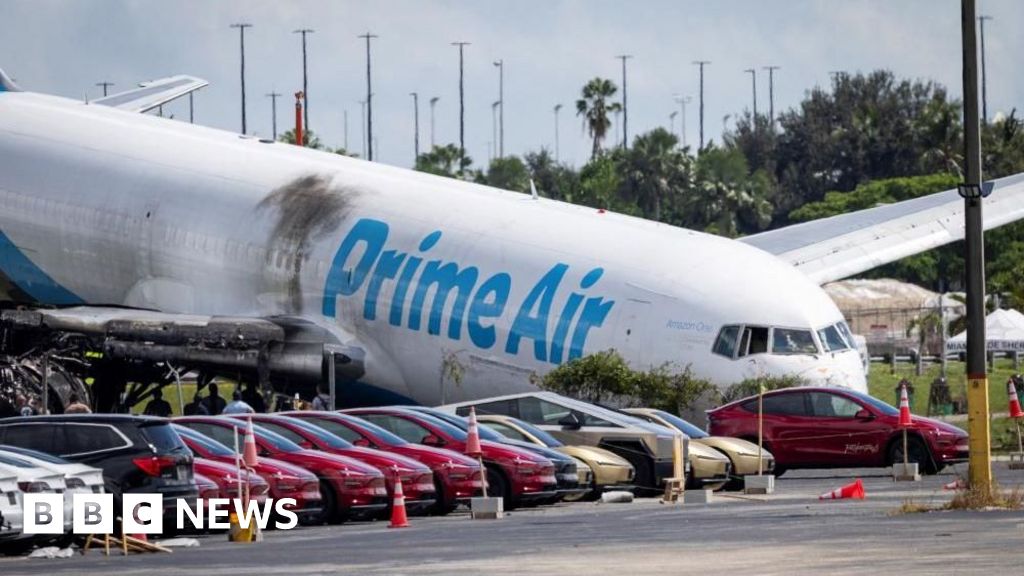 BBC News image for Five killed in Miami plane crash landing were in two vehicles, investigators say - BBC