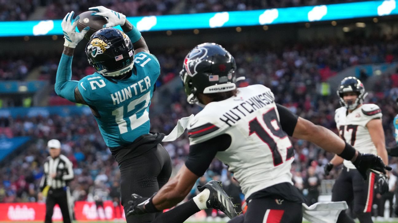 ESPN image for Travis Hunter stars in Jaguars' loss, is 1st with INT and TD catch since 2002 - ESPN