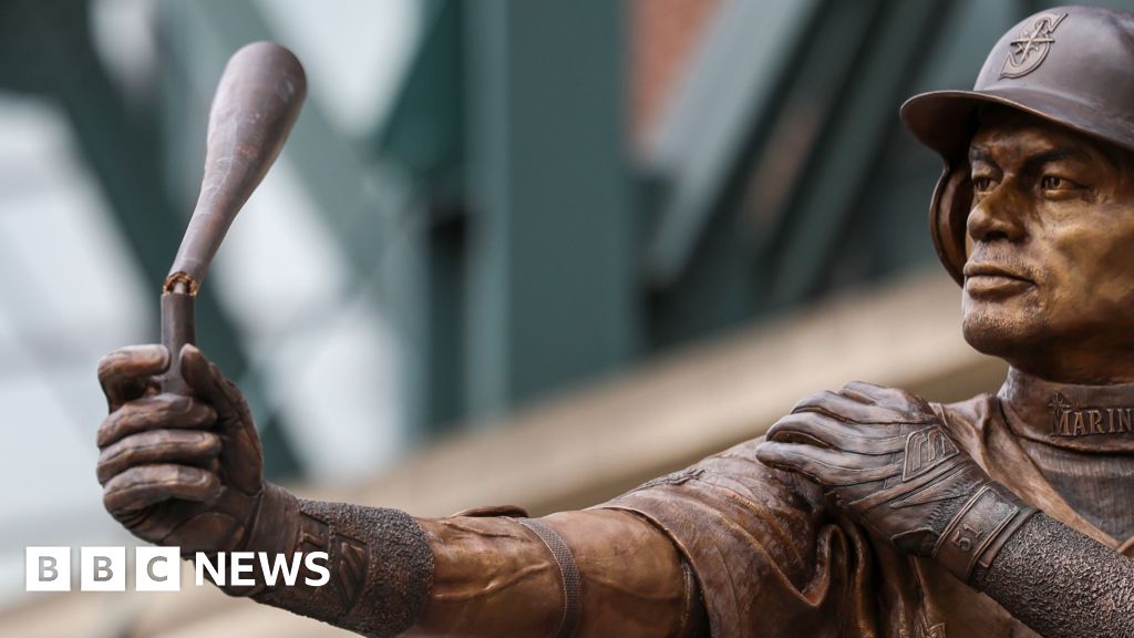 BBC News image for Baseball statue broken as it is unveiled in Seattle - BBC