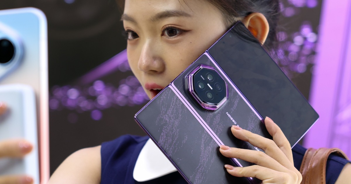 NBC News image for Chinese tech giants Huawei and Xiaomi launch new foldable smartphones ahead of Apple event - NBC News