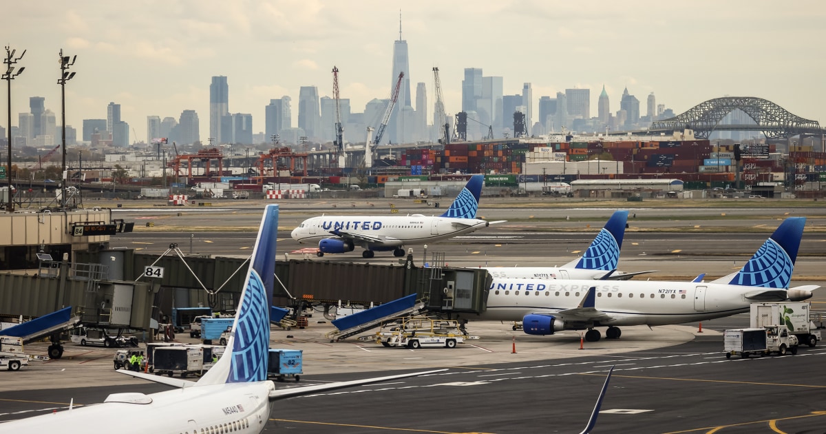 NBC News image for Driver on N.J. Turnpike hurt as United plane hits pole on approach to Newark airport - NBC News