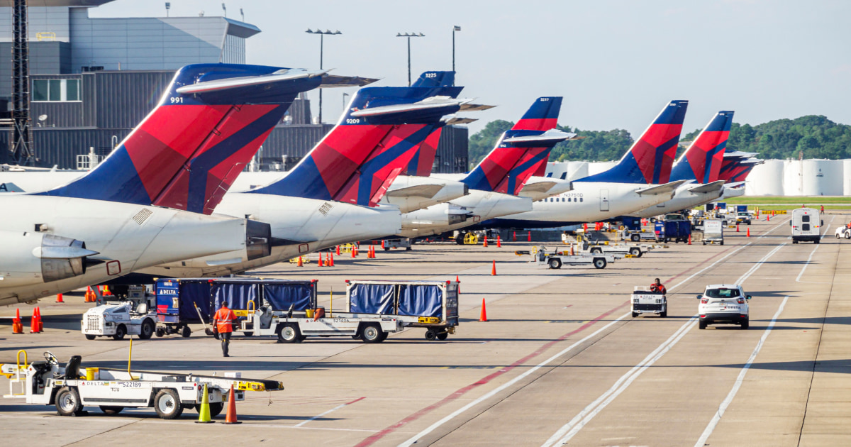 NBC News image for Delta passengers evacuated by slide after emergency landing in Atlanta - NBC News