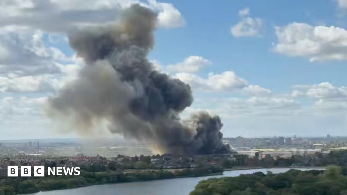 BBC News image for Huge fire at Neasden waste facility shuts Tube and train lines
