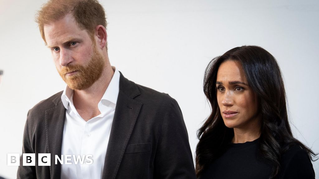 BBC News image for Harry and Meghan accuse royal author of 'deranged conspiracy' - BBC