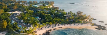 Aerial view of resort with ocean surrounding it
