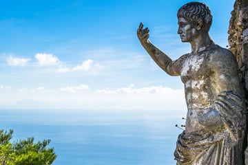 Statue in front of beautiful views