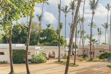 View of a hotel with palm trees