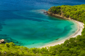 Coastal scenery in Grenada with logo