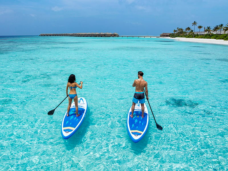 paddle boarding in Hurawalhi Island Resort
