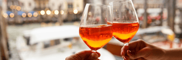 Enjoy a drink alongside the canals of Venice