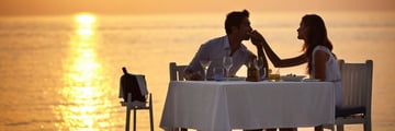 Couple dining on adult-only beach